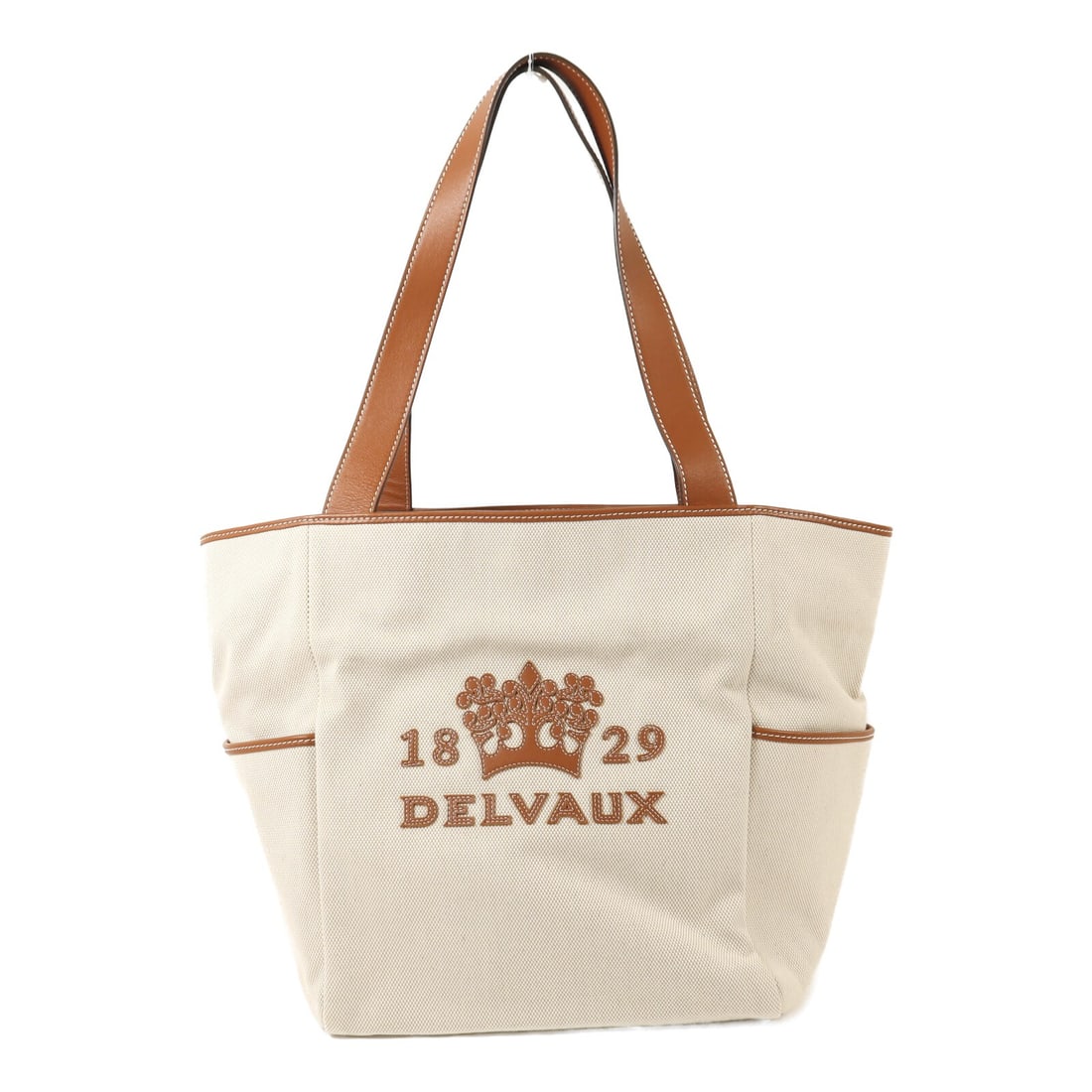 Delvaux Beige Canvas Two Way Tote Shoulder Bag with Gold Hardware: Delvaux Beige Canvas Two Way Tote Shoulder Bag with Gold Hardware This Delvaux 2-way tote and shoulder bag features beige canvas construction and a versatile design that allows it to be carried by han