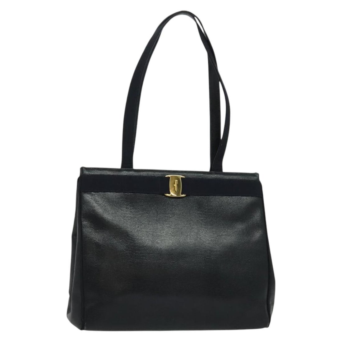 Salvatore Ferragamo Navy Leather Tote Vintage Vara Bow Design: Salvatore Ferragamo Navy Leather Tote Vintage Vara Bow Design This vintage Salvatore Ferragamo Vara Bow Tote is crafted from navy lizard-embossed leather, designed for women. It features a classic bow