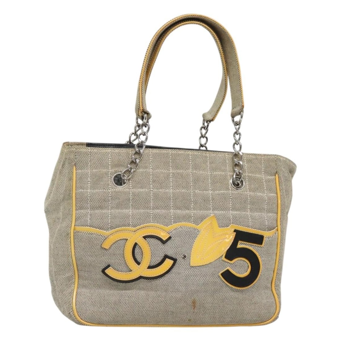 Chanel Camellia No5 Beige Canvas Tote Bag 25cm by 20cm by 11cm: Chanel Camellia No5 Beige Canvas Tote Bag 25cm by 20cm by 11cm This pre-owned Chanel Camellia No.5 Tote for women features a beige canvas exterior with signs of use including surface rubbing, stains,