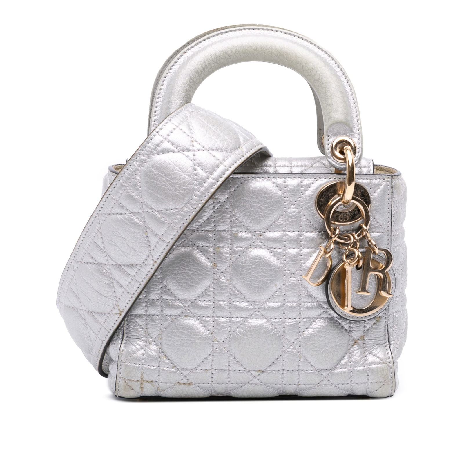 Dior Mini Metallic Grained Calfskin Cannage Lady Dior Silver Bag: Dior Mini Metallic Grained Calfskin Cannage Lady Dior Silver Bag Introducing the Mini Metallic Grained Calfskin Cannage Lady Dior, a stunning bag that combines luxury with practicality. This exquisite