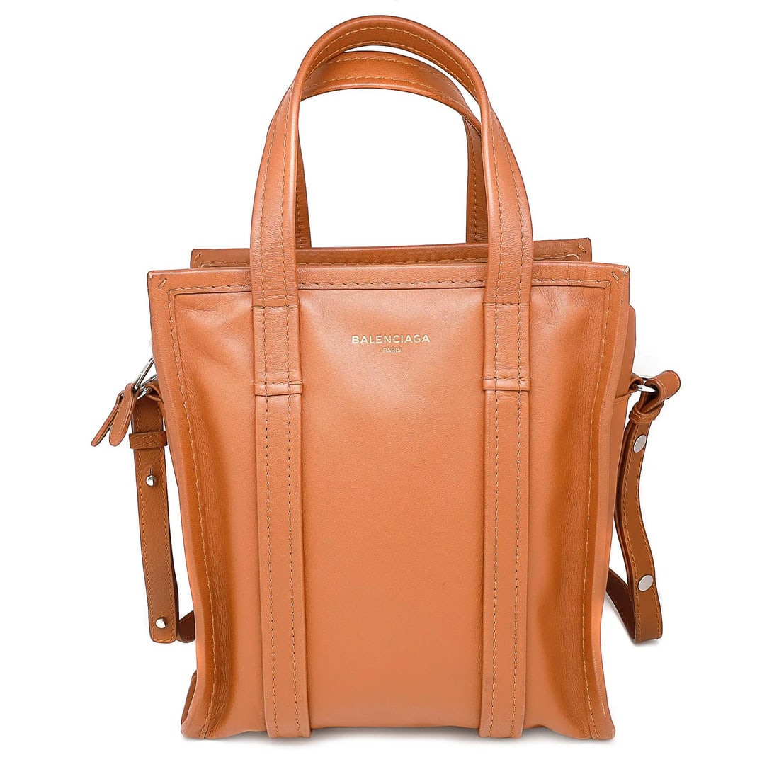 Balenciaga Bazar Shopper XS Tan Leather Messenger Bag with Gold Logo: Balenciaga Bazar Shopper XS Tan Leather Messenger Bag with Gold Logo Introducing the Balenciaga Bazar Shopper XS, a chic and versatile messenger bag crafted from subtly distressed mid-shine tan leathe