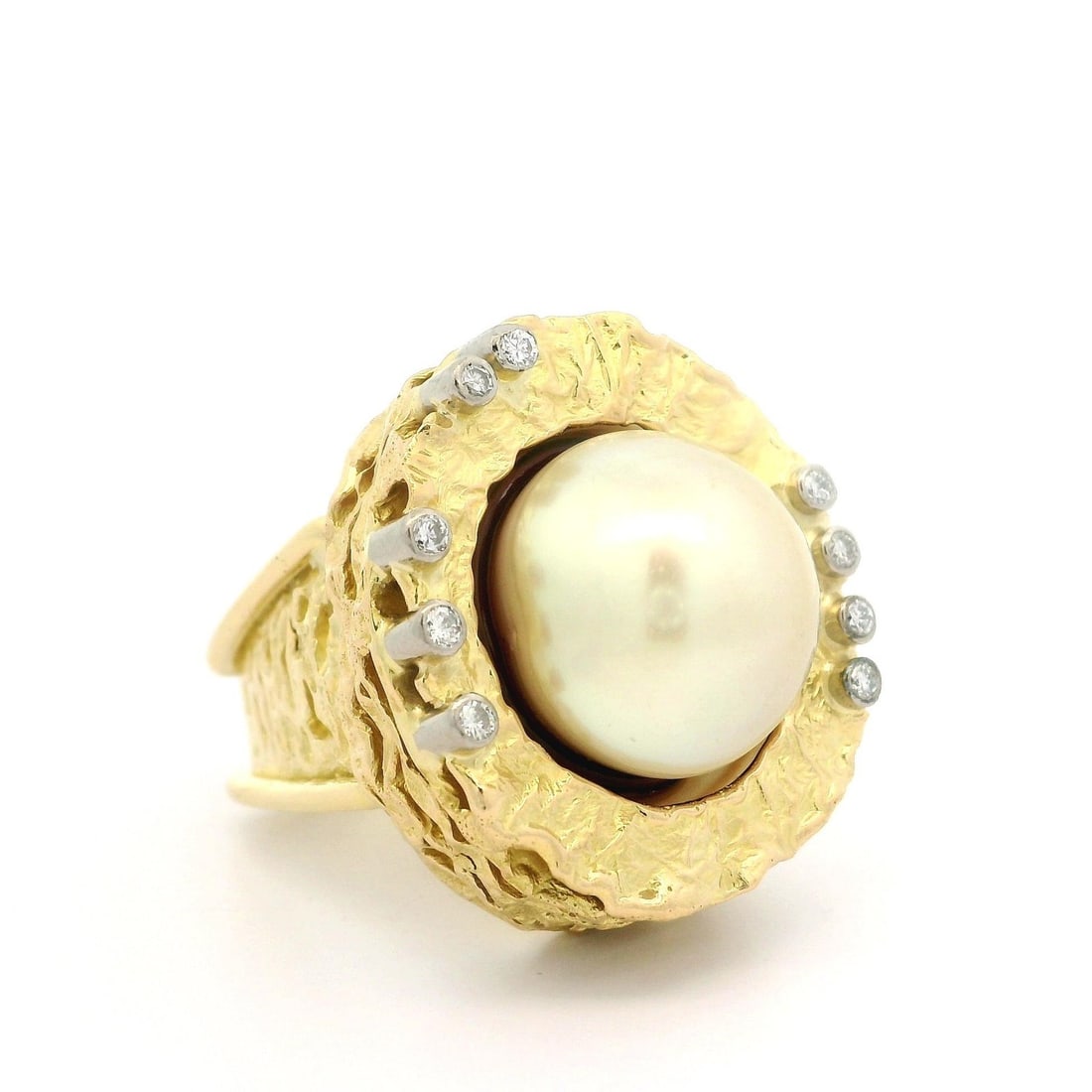 18k Yellow Gold Cocktail Ring with Golden Pearl and Diamond Nugget: 18k Yellow Gold Cocktail Ring with Golden Pearl and Diamond Nugget This exquisite cocktail ring features a stunning button-shaped golden pearl accented with natural diamonds. The pearl, measuring appr