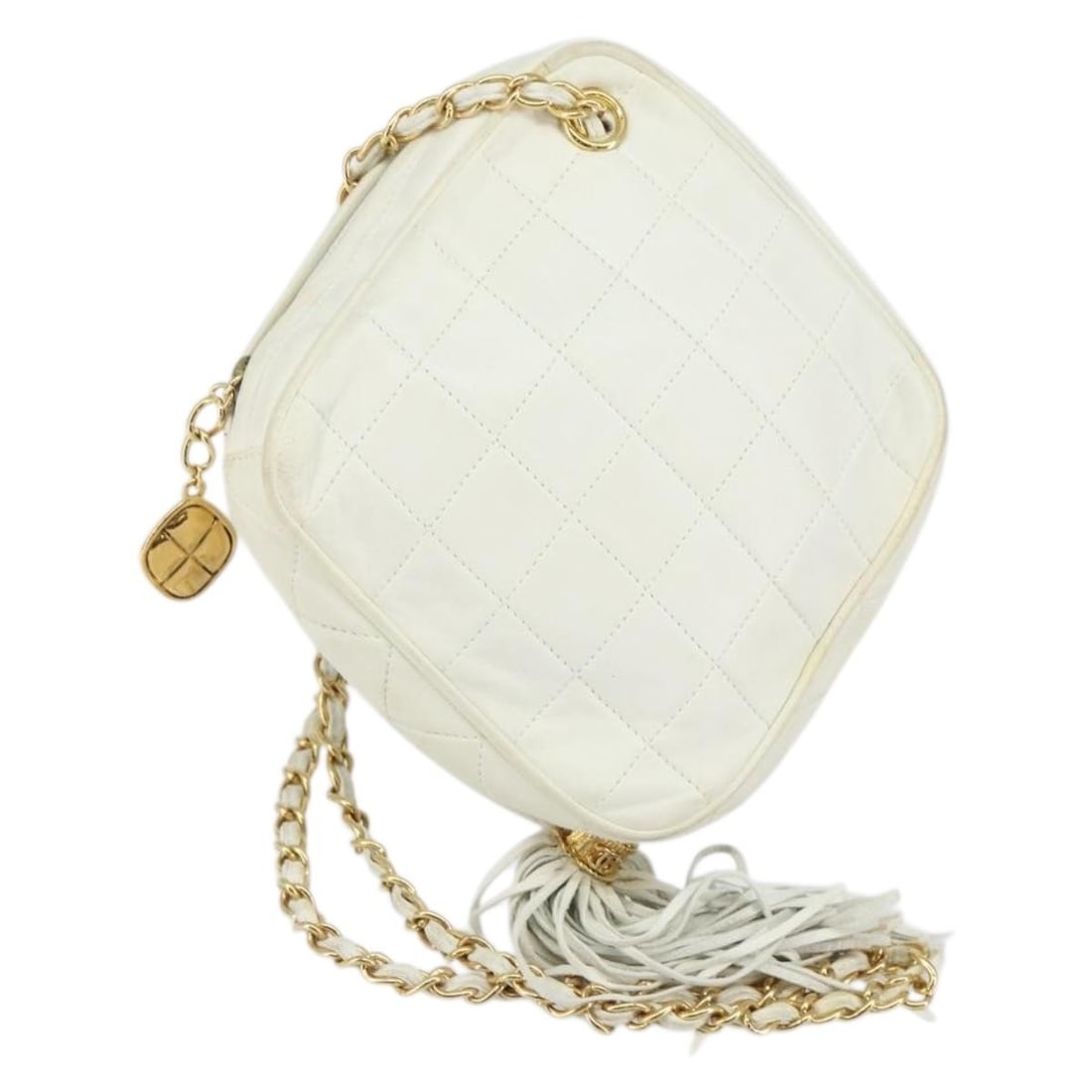 White Quilted Leather Chanel Crossbody Bag with Tassel Accent: White Quilted Leather Chanel Crossbody Bag with Tassel Accent This Chanel Vintage Diamond Tassel Crossbody bag is crafted from white quilted leather and features a tassel detail. Designed for women, i
