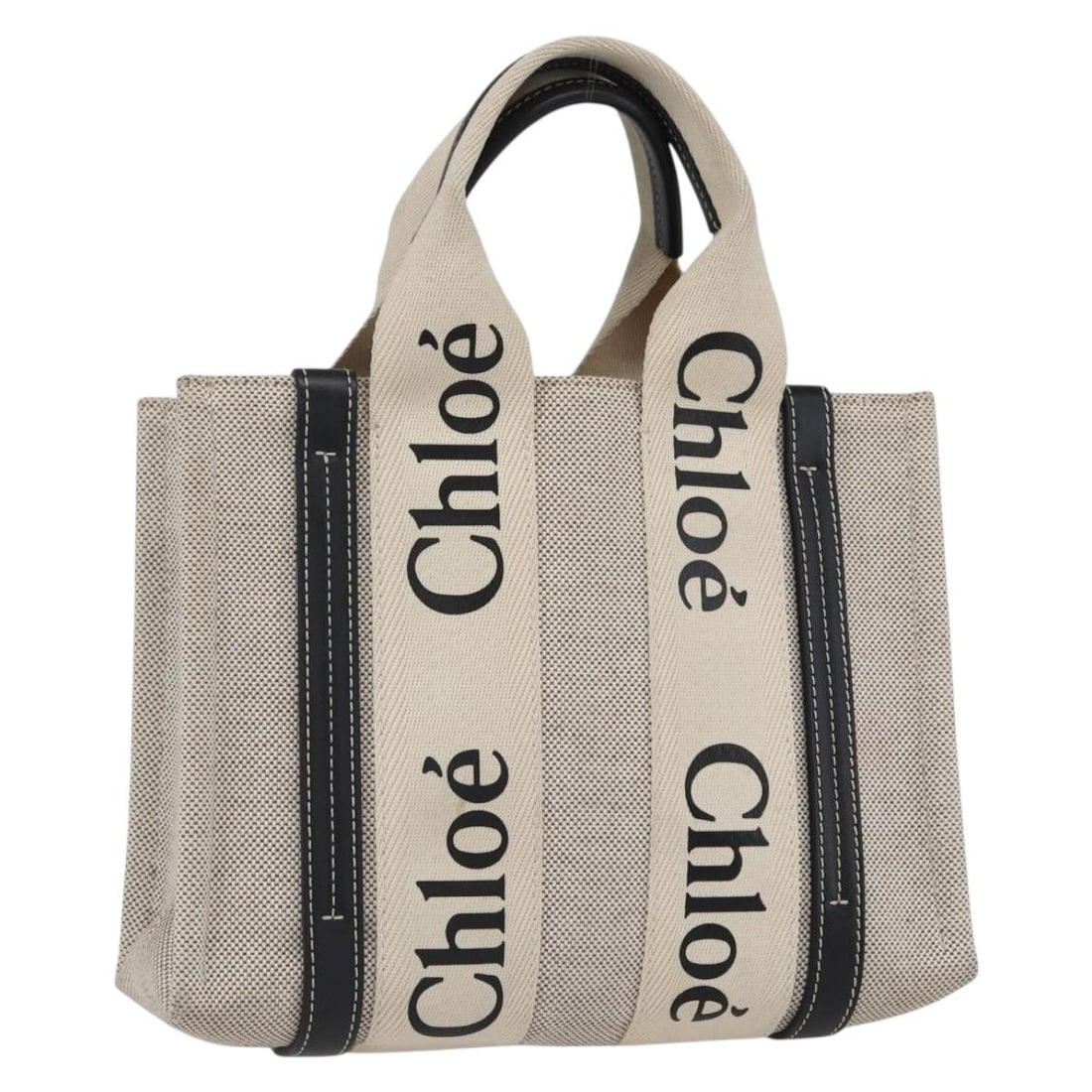 Chloe Woody Small Canvas Beige Tote Bag with Dust Bag: Chloe Woody Small Canvas Beige Tote Bag with Dust Bag This Chloe Woody small handbag features a beige canvas exterior and is designed with a practical top handle. The bag is crafted in Italy and comes