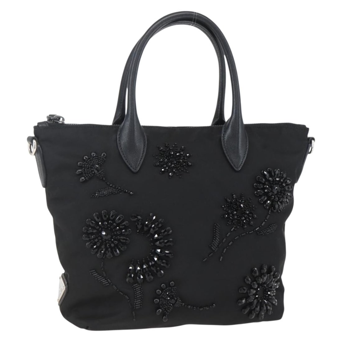 PRADA Black Silver Nylon Beads Hand Bag Auth Italy AM10030V: PRADA Black Silver Nylon Beads Hand Bag Auth Italy AM10030V This PRADA hand bag is a stylish accessory crafted from durable nylon, featuring a chic black and silver color scheme. With its compact dime