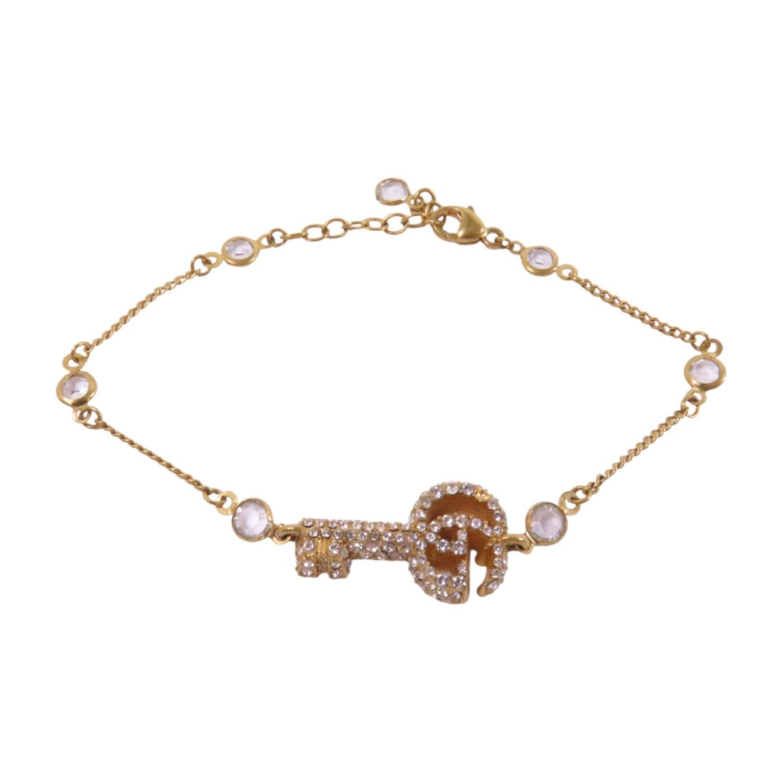 GUCCI GG Bracelet with Gold Tone Strass 927 Sterling Silver: GUCCI GG Bracelet with Gold Tone Strass 927 Sterling Silver This exquisite Gucci bracelet features a stylish design crafted from sterling silver with a captivating clear color. The bracelet is adorned