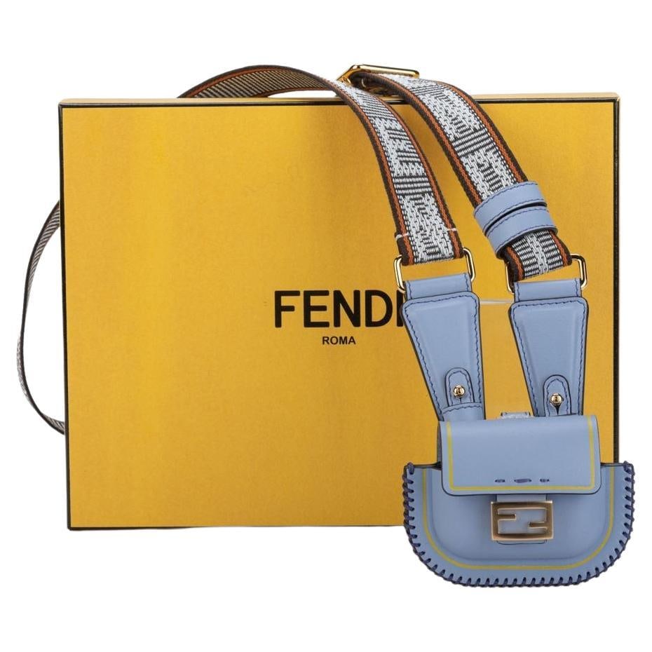 Fendi Light Blue Leather Bag Necklace Adjustable Strap NIB: Fendi Light Blue Leather Bag Necklace Adjustable Strap NIB This exquisite Fendi Bag Necklace in light blue is a unique accessory that effortlessly combines fashion and functionality. Crafted from high