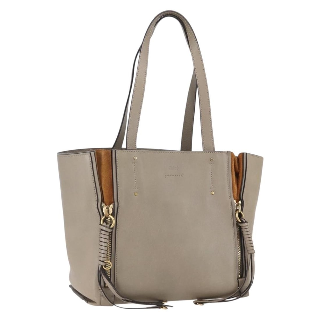 Beige Leather Milo Shopping Tote by Chloe: Beige Leather Milo Shopping Tote by Chloe The Chloe Milo Shopping Tote is crafted from beige leather and designed for women. This Italian-made tote features a spacious interior and shows signs of