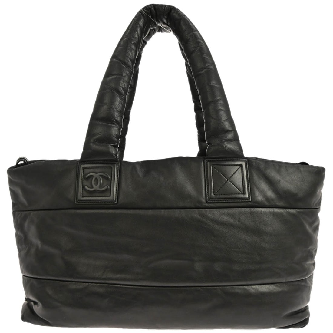 Large Coco Cocoon Top Handle Tote by Chanel in Black Calfskin Leather: Large Coco Cocoon Top Handle Tote by Chanel in Black Calfskin Leather This Chanel Coco Cocoon tote handbag is crafted from black calfskin leather and features a spacious large size, ideal for casual o
