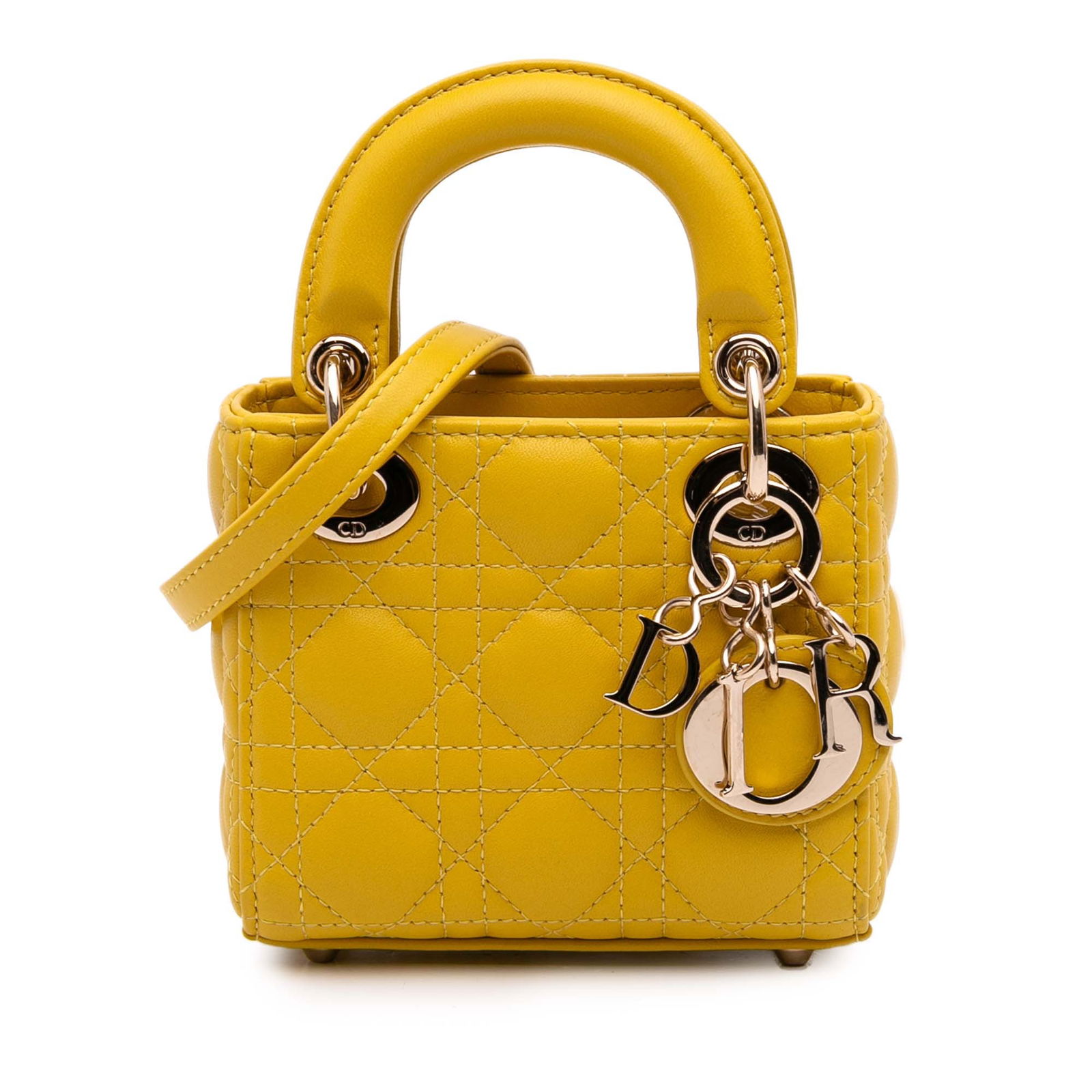 Dior Micro Lambskin Cannage Lady Dior Yellow Bag: Dior Micro Lambskin Cannage Lady Dior Yellow Bag The Micro Lady Dior is a sophisticated handbag crafted from luxurious quilted lambskin leather. It features flat leather top handles and a detachable f