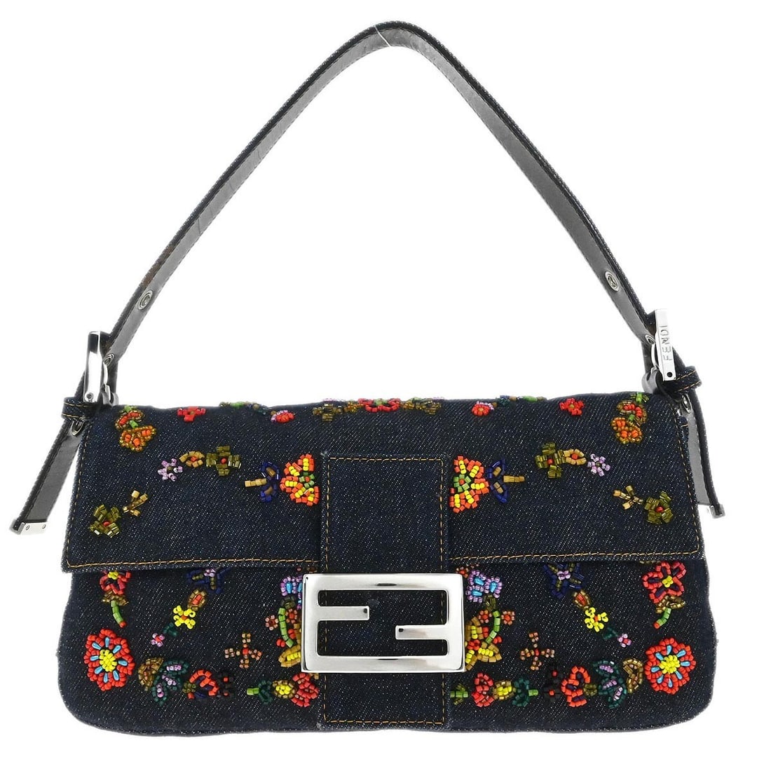 Fendi Baguette Navy Denim Shoulder Bag with Beaded Detail: Fendi Baguette Navy Denim Shoulder Bag with Beaded Detail This Fendi Baguette handbag features a navy denim exterior accented with beaded details and the iconic Fendi logo. Designed for casual occasio