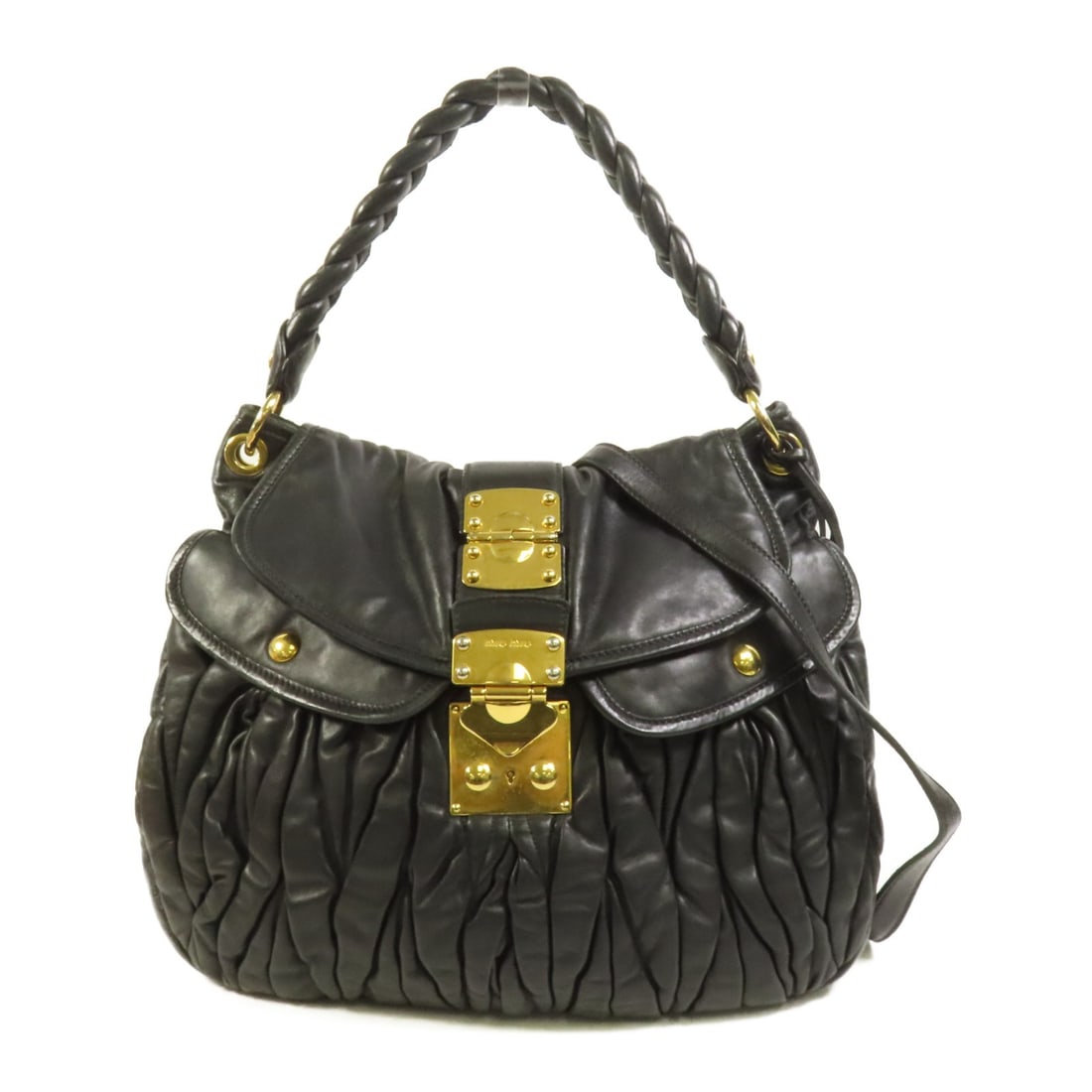 Black Lambskin 2 Way Shoulder Bag by Miu Miu with Gold Tone Hardware: Black Lambskin 2 Way Shoulder Bag by Miu Miu with Gold Tone Hardware This Miu Miu 2-way shoulder bag is crafted from black lambskin leather and features gold tone hardware. Designed for versatile