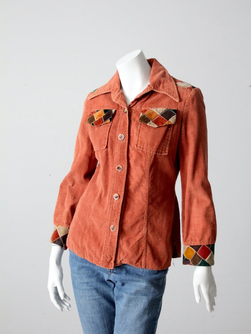 1970s Vintage Terra Cotta Patchwork Corduroy Shirt: 1970s Vintage Terra Cotta Patchwork Corduroy Shirt Discover a unique piece from the 1970s with this vintage patchwork corduroy shirt, featuring a beautiful terra cotta tone. The shirt is adorned with