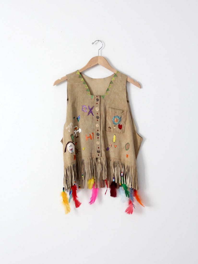 1980s Vintage Hand-Painted Leather Vest with Beaded Feathers: 1980s Vintage Hand-Painted Leather Vest with Beaded Feathers Discover a unique piece of fashion history with this 1980s vintage hand-painted and beaded leather vest. Crafted from soft, sand-toned sued