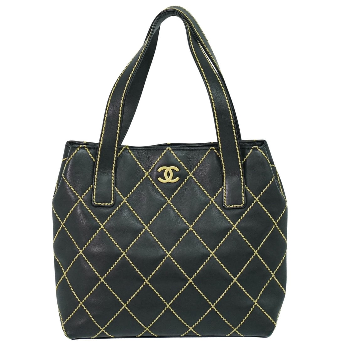 Black Quilted Leather Surpique Tote Bag by Chanel: Black Quilted Leather Surpique Tote Bag by Chanel The Chanel Surpique Tote features a quilted leather design in black and is crafted for women. This pre-owned tote shows signs of use, including scratc