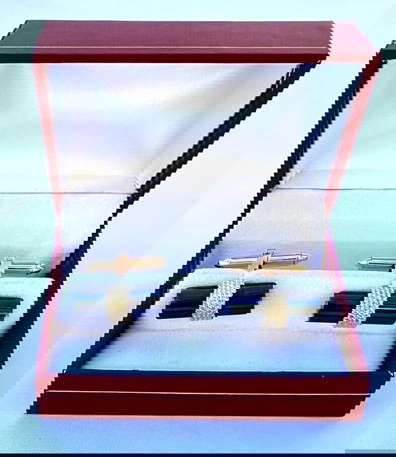 14K Yellow Gold Hematite Cufflinks with Hallmark Signature: 14K Yellow Gold Hematite Cufflinks with Hallmark Signature Elevate your formal attire with this exquisite pair of cufflinks crafted from 14K yellow gold featuring stunning hematite stones. Each cuffli