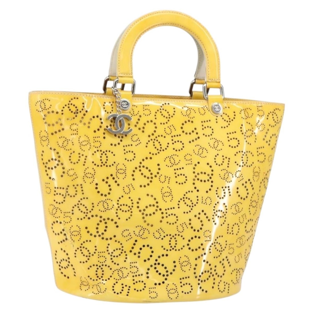 Yellow Patent Leather Chanel No.5 Perforated Shopping Tote: Yellow Patent Leather Chanel No.5 Perforated Shopping Tote This pre-owned Chanel CC No.5 Shopping Tote for women is crafted from yellow patent leather. It features a spacious design measuring 29cm x 3