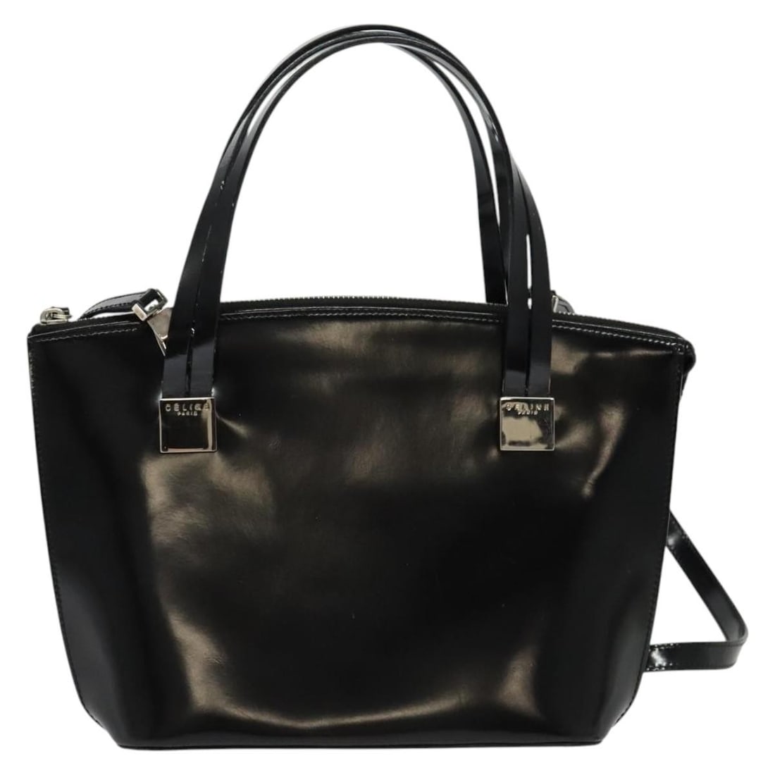 Black Patent Leather Celine Bag 22cm Italian Made: Black Patent Leather Celine Bag 22cm Italian Made This Celine handbag is crafted from black patent leather and is designed for women. Made in Italy, the bag features a structured silhouette with dimen