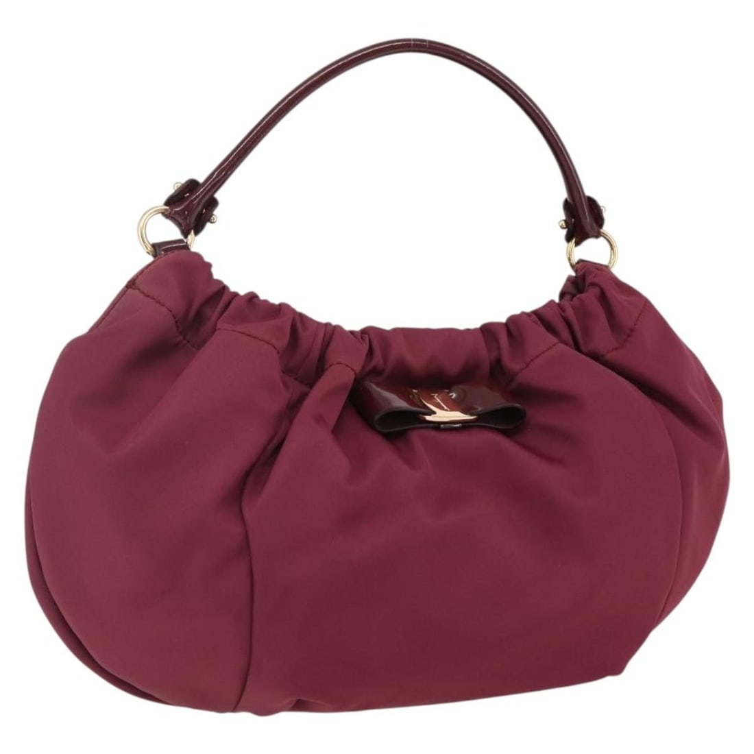 Bordeaux Nylon Salvatore Ferragamo Handbag with Gold Accents Made in Italy: Bordeaux Nylon Salvatore Ferragamo Handbag with Gold Accents Made in Italy This Salvatore Ferragamo handbag is crafted from durable nylon in a rich Bordeaux color with gold-tone accents. Made in Italy