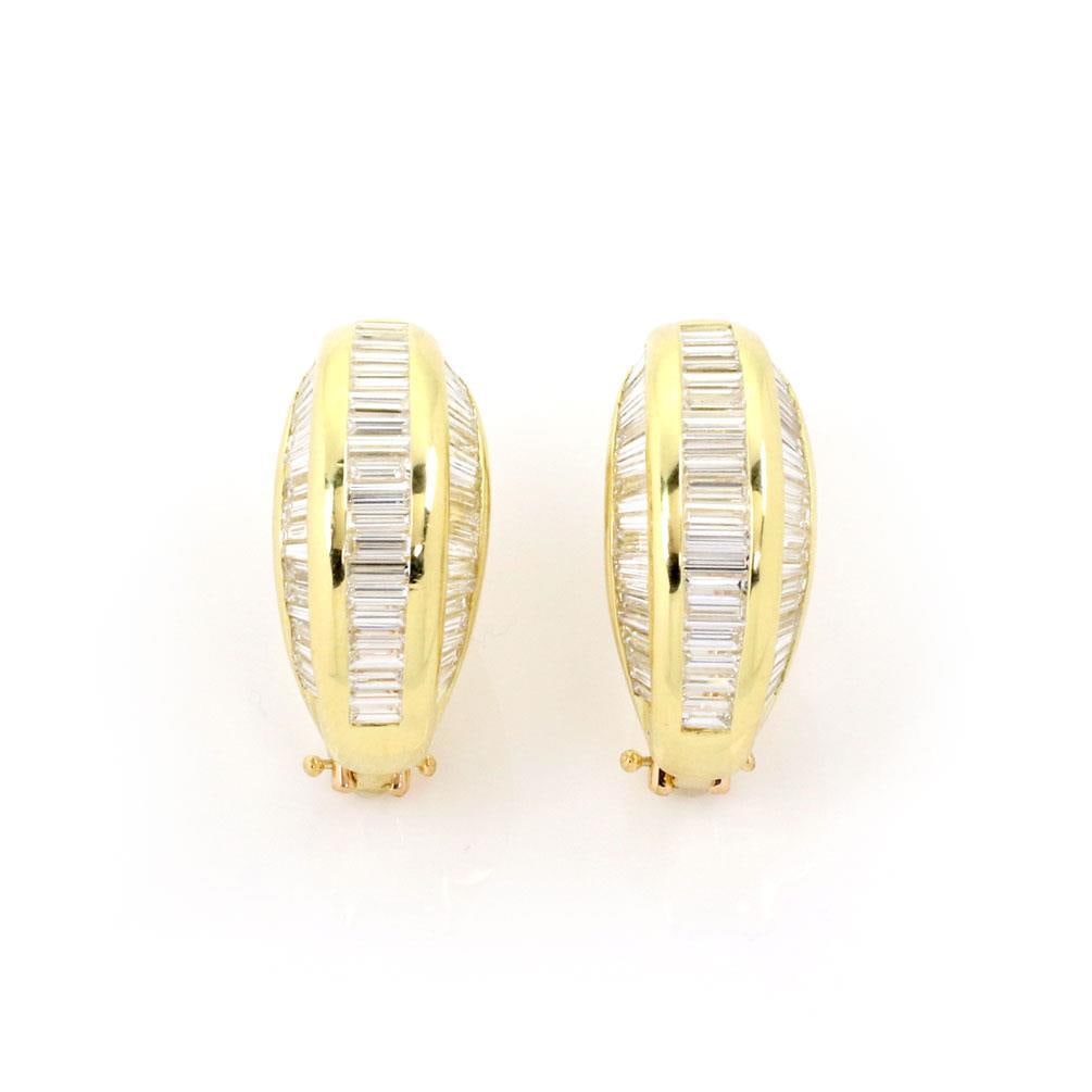 18k Yellow Gold 8 Carat Baguette Diamond Curved Huggie Earrings: 18k Yellow Gold 8 Carat Baguette Diamond Curved Huggie Earrings Elevate your elegance with these stunning 18k yellow gold huggie earrings. Designed in a fashionable wide curved shape, these earrings s
