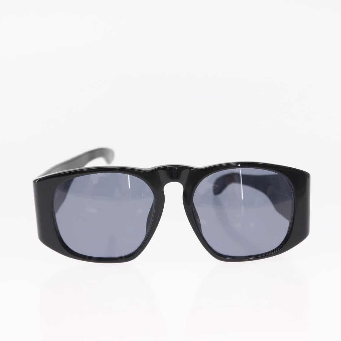 Black Plastic Sunglasses by Chanel with CC Logo: Black Plastic Sunglasses by Chanel with CC Logo Pre-owned Chanel Logo CC sunglasses designed for women, featuring black plastic frames with the iconic CC logo. These sunglasses are crafted in Italy an