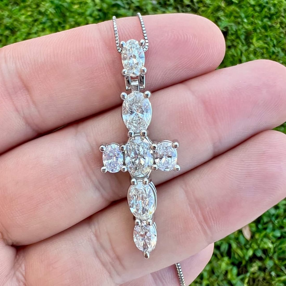 Stunning Platinum 5.00 Ct Diamond Cross Necklace with 7 Oval Diamonds: Stunning Platinum 5.00 Ct Diamond Cross Necklace with 7 Oval Diamonds This stunning Platinum Diamond Cross Necklace showcases an exquisite design, featuring 7 oval diamonds that weigh approximately 5.