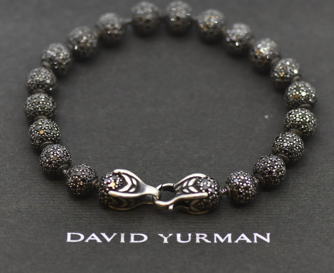 Sterling Silver Chain Bracelet with Black Diamonds by David Yurman: Sterling Silver Chain Bracelet with Black Diamonds by David Yurman This David Yurman bracelet features a chain design crafted from sterling silver with a purity of 925. The piece is set with striking
