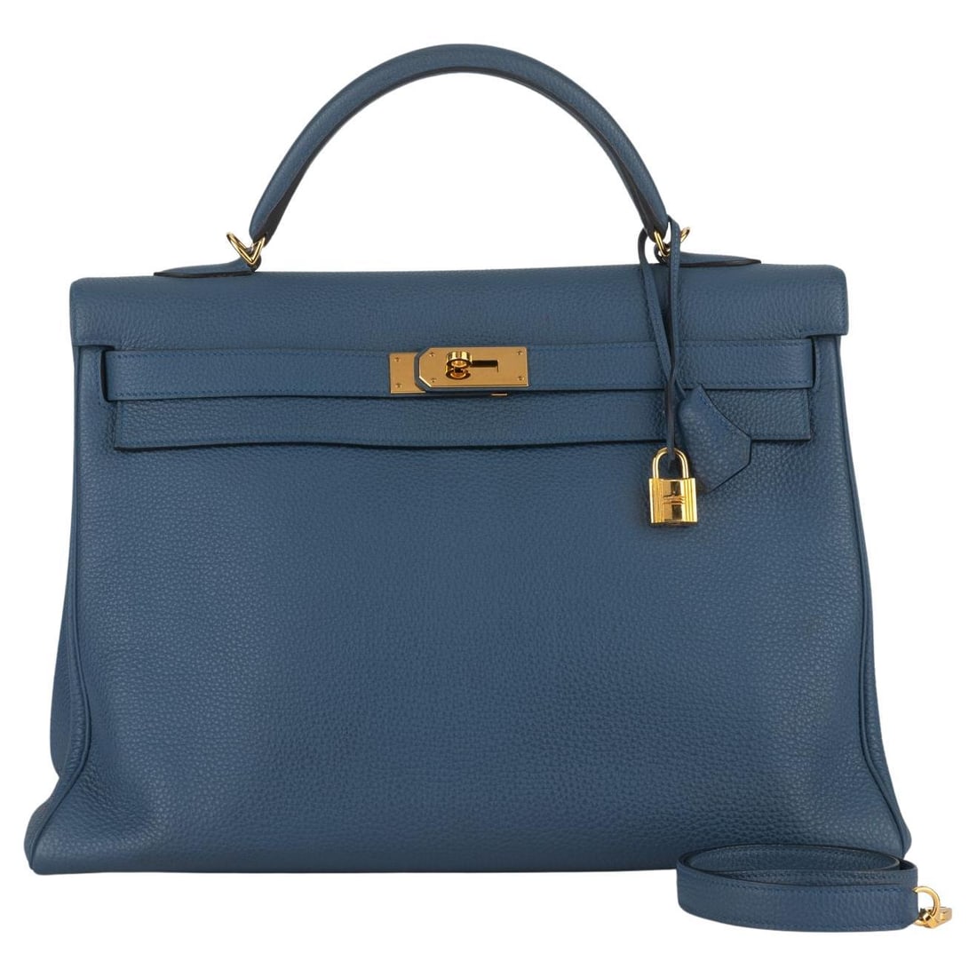 Hermes Kelly Retourne 40 in Bleu Brighton Togo Leather: Hermes Kelly Retourne 40 in Bleu Brighton Togo Leather This exquisite Hermes Retourne Kelly 40 handbag is crafted from luxurious Bleu Brighton togo leather, showcasing the brand's renowned quality and