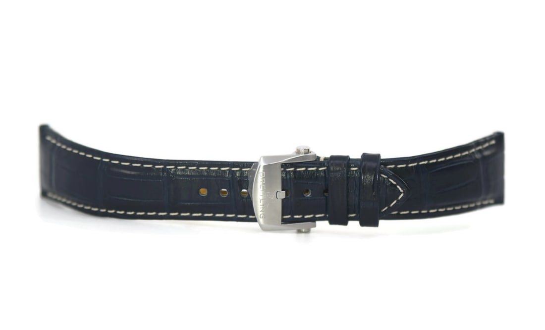 Authentic Breitling Dark Blue Leather Watch Strap 22mm: Authentic Breitling Dark Blue Leather Watch Strap 22mm Enhance your timepiece with this authentic Breitling dark blue leather strap designed for wristwatches. Crafted from high-quality leather, this s