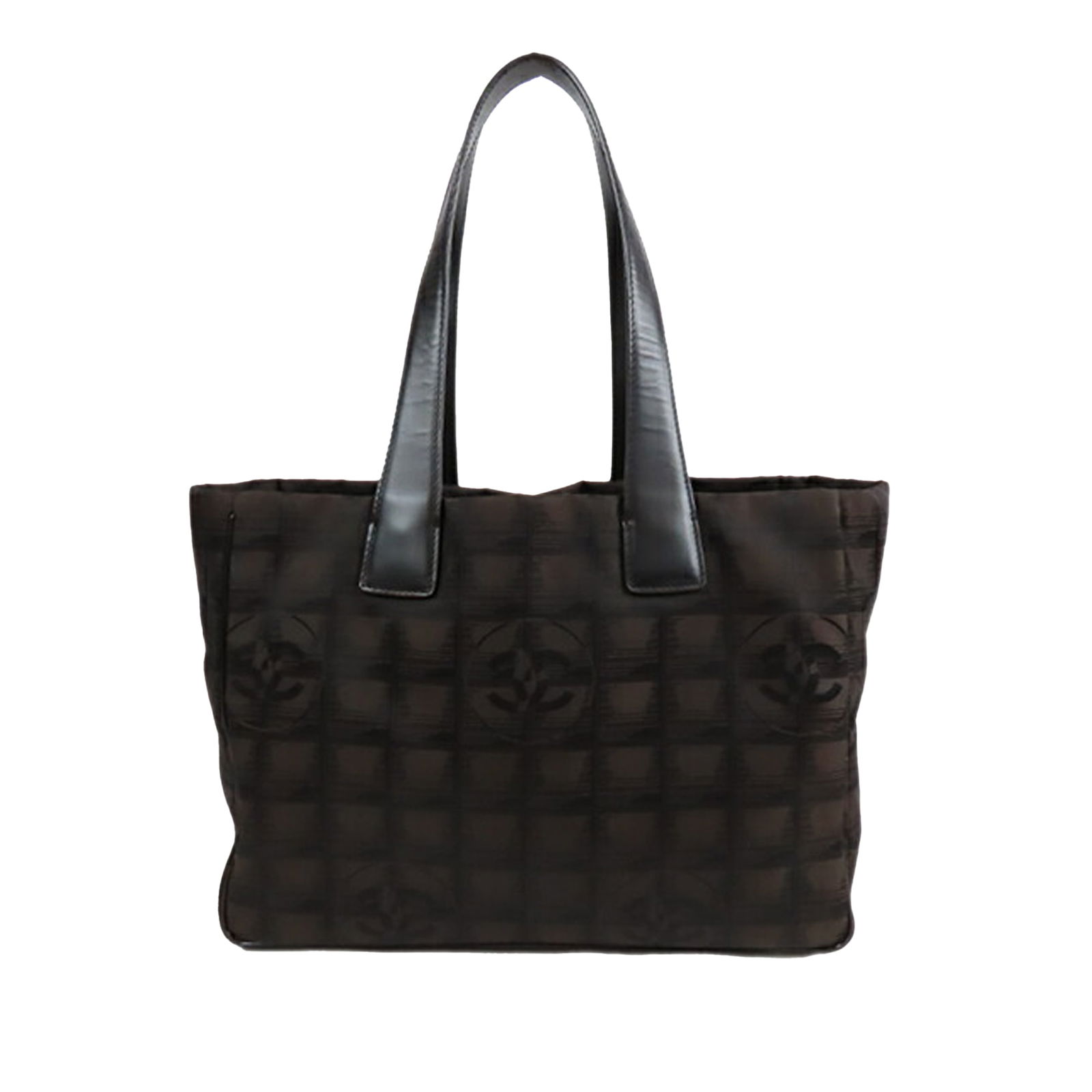Brown Chanel Tote Bag New Travel Line Nylon with Leather Handles: Brown Chanel Tote Bag New Travel Line Nylon with Leather Handles This Chanel New Travel Line tote features a brown nylon body with flat leather straps, an open top, and interior zip pockets. The bag i