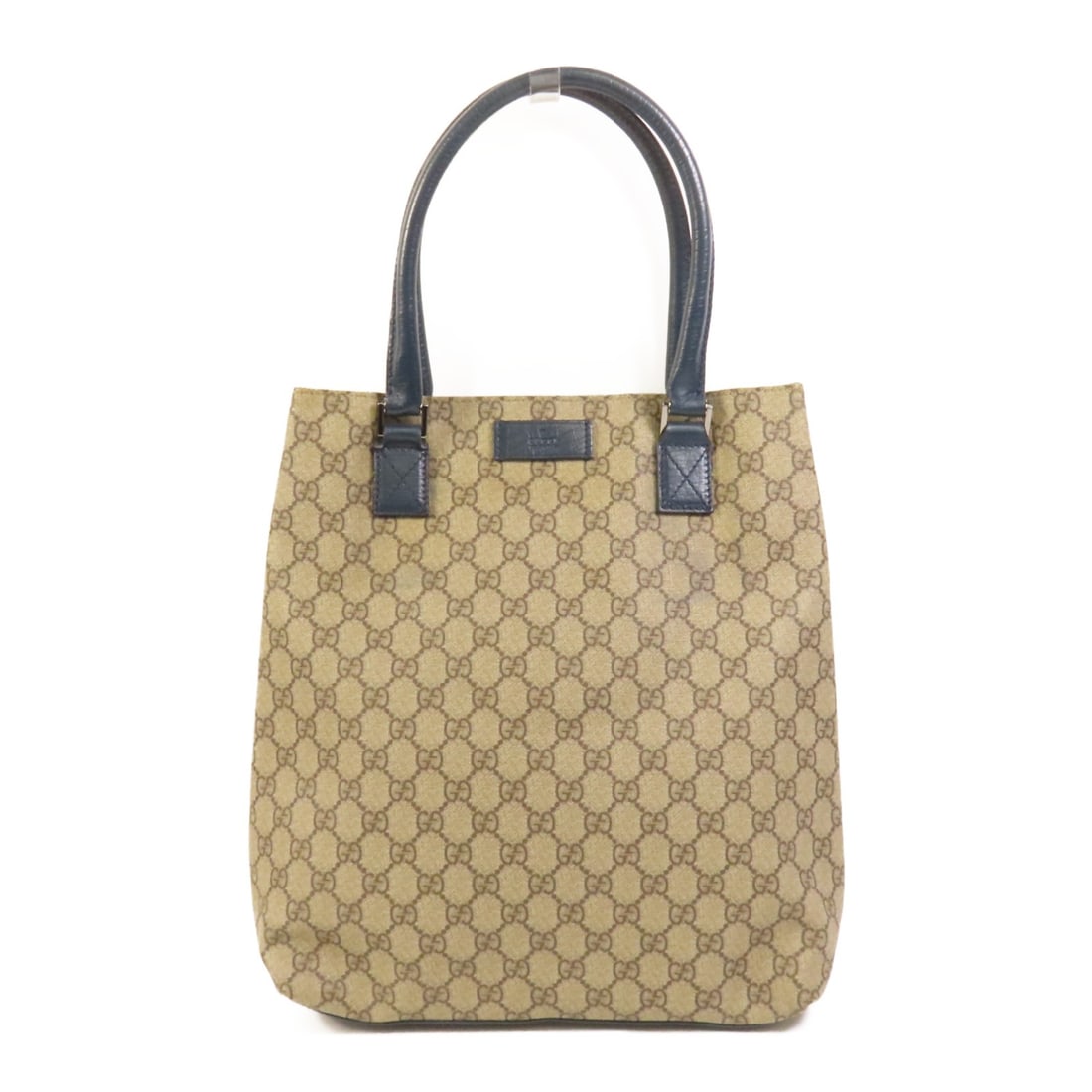 Brown and Blue GG Canvas Tote Bag by Gucci with Silver Hardware: Brown and Blue GG Canvas Tote Bag by Gucci with Silver Hardware This Gucci tote bag features the signature GG canvas exterior in brown with blue accents and silver-tone hardware. Designed with a regul