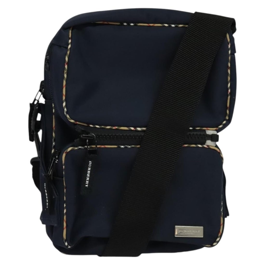 Navy Nylon Vintage Unisex Shoulder Bag by Burberry: Navy Nylon Vintage Unisex Shoulder Bag by Burberry This Burberry vintage shoulder bag is crafted from navy nylon and designed for unisex use. The bag features a spacious interior and is accented with