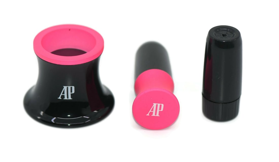 Pink Watch Loupe Set for Audemars Piguet Timepieces: Pink Watch Loupe Set for Audemars Piguet Timepieces This is an Audemars Piguet pink watch loupe set, designed for detailed watch inspection or repair. The set originates from Switzerland and is in pre