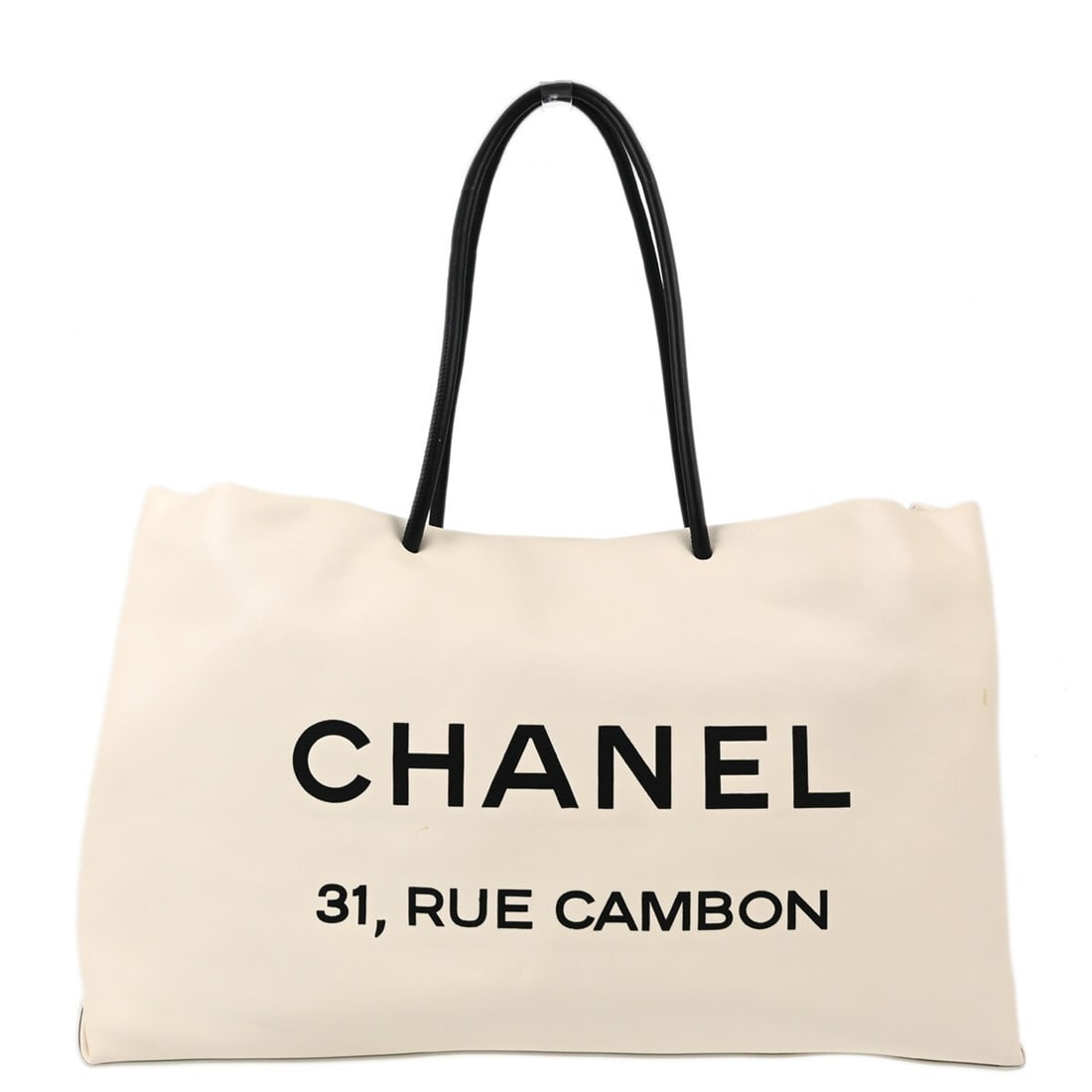 Chanel White Calfskin Tote Bag with Black Handles: Chanel White Calfskin Tote Bag with Black Handles Introducing the Chanel White Calfskin Essential Tote Bag, a perfect blend of elegance and functionality. This medium-sized tote features a stylish bla