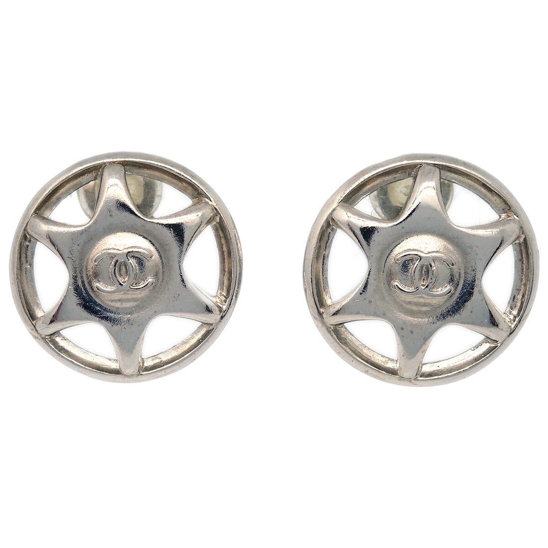 Chanel 97A Silver Clip-On Button Earrings: Chanel 97A Silver Clip-On Button Earrings Elevate your accessory collection with these stunning Chanel button earrings. Crafted in a classic round shape, these clip-on earrings showcase a sleek silver