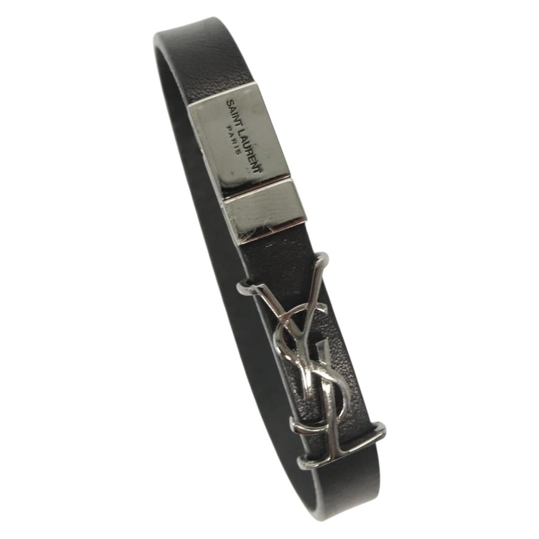 SAINT LAURENT Cassandra Black Metal Bracelet with Dust Bag: SAINT LAURENT Cassandra Black Metal Bracelet with Dust Bag Elevate your accessory collection with the SAINT LAURENT Cassandra Bracelet. This stylish bracelet is crafted from durable metal and features