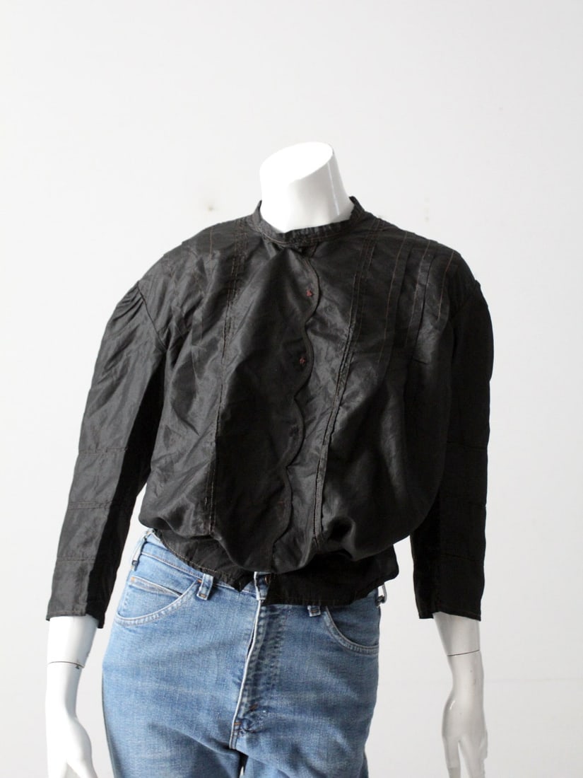 Antique Victorian Black Silk Blouse with Stitch Detailing: Antique Victorian Black Silk Blouse with Stitch Detailing This exquisite Antique Victorian Black Silk Blouse showcases the elegance of its era, featuring a button-up design with intricate stitch detai
