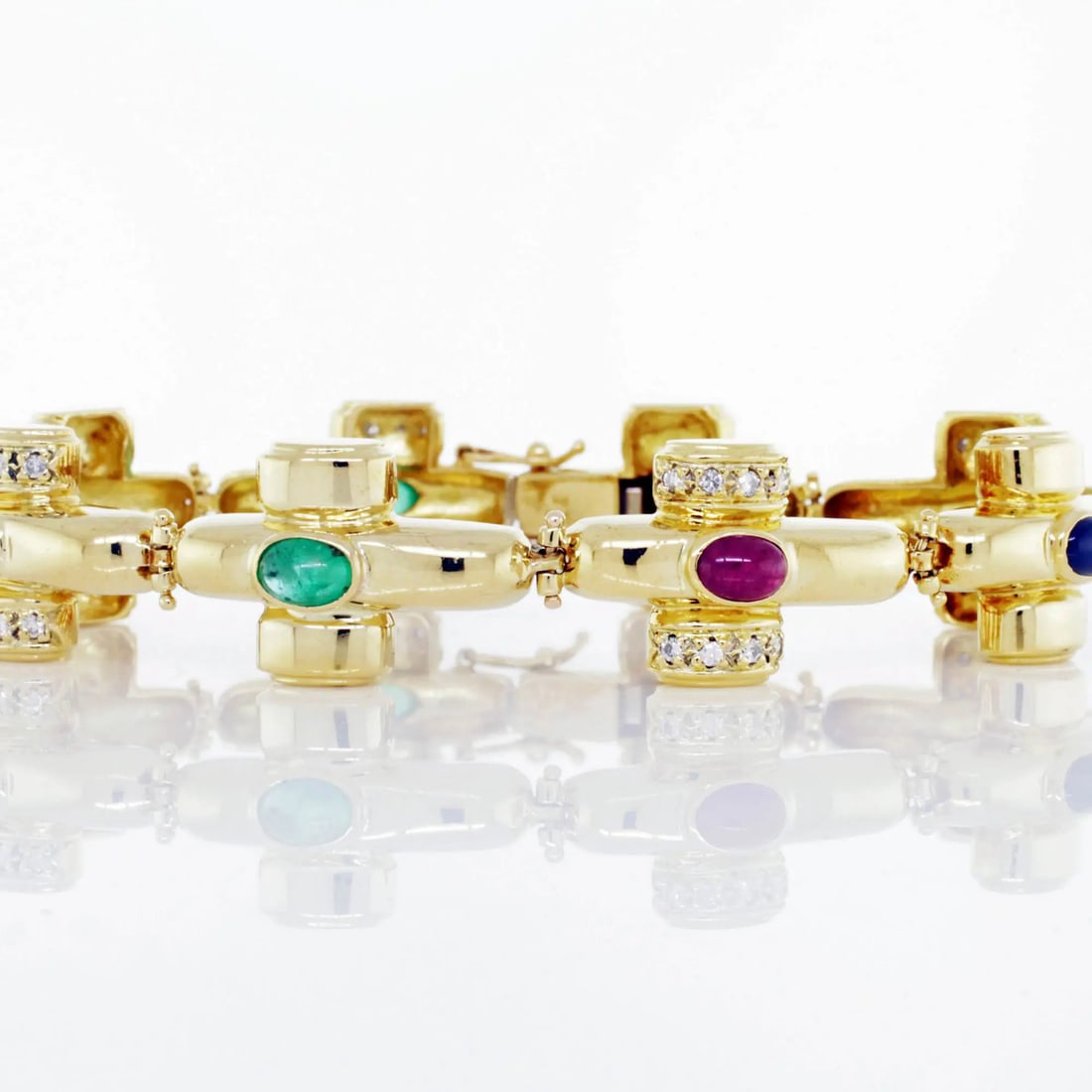 Catherine Mullen 18K Yellow Gold Gemstone Bracelet with Diamonds and Sapphires: Catherine Mullen 18K Yellow Gold Gemstone Bracelet with Diamonds and Sapphires This stunning Catherine Mullen bracelet features a vibrant blend of precious stones, including natural diamonds, cabochon