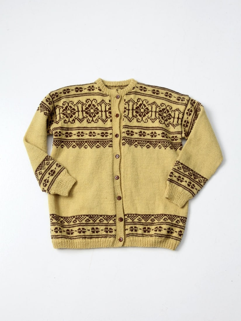 Vintage Goldenrod Hand Knit Nordic Wool Cardigan Snowflake Pattern: Vintage Goldenrod Hand Knit Nordic Wool Cardigan Snowflake Pattern This vintage hand-knit Nordic wool cardigan is an ideal choice for staying warm during chilly days. Crafted in a goldenrod hue, it sh