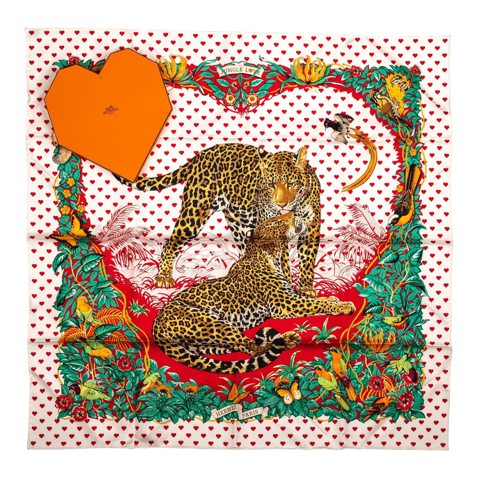 Hermes Limited Edition Jungle Love Hearts Scarf New in Heart Box: Hermes Limited Edition Jungle Love Hearts Scarf New in Heart Box Experience the elegance of the Hermes Limited Edition Jungle Love Hearts Dallet Scarf. This exquisite scarf features a vibrant signatur