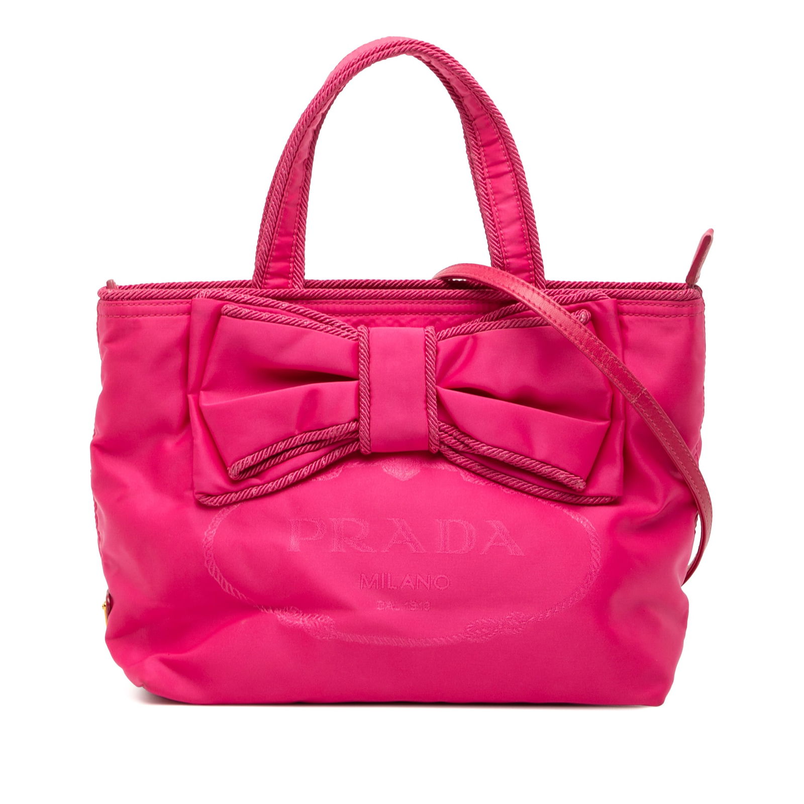 Prada Pink Tessuto Canapa Satchel with Logo Bow and Detachable Strap: Prada Pink Tessuto Canapa Satchel with Logo Bow and Detachable Strap This Prada Tessuto Canapa Logo Bow Satchel features a pink nylon fabric body with a distinctive bow detail, flat handles, and a det