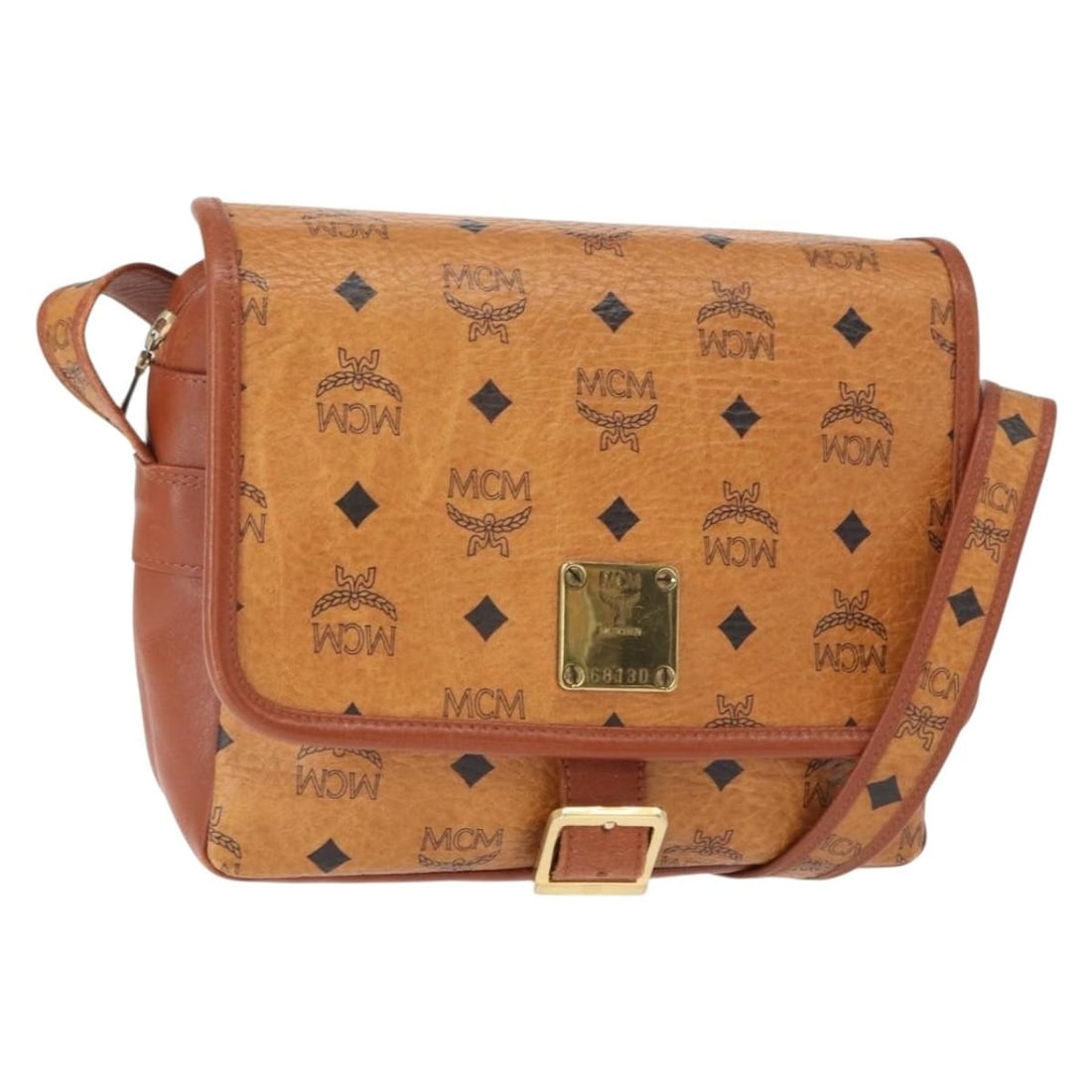 Brown Canvas and Leather Shoulder Bag by MCM Visetos 22cm: Brown Canvas and Leather Shoulder Bag by MCM Visetos 22cm This pre-owned MCM Visetos shoulder bag for women features brown canvas material with leather accents. It measures 22cm x 19cm x 7cm and was m