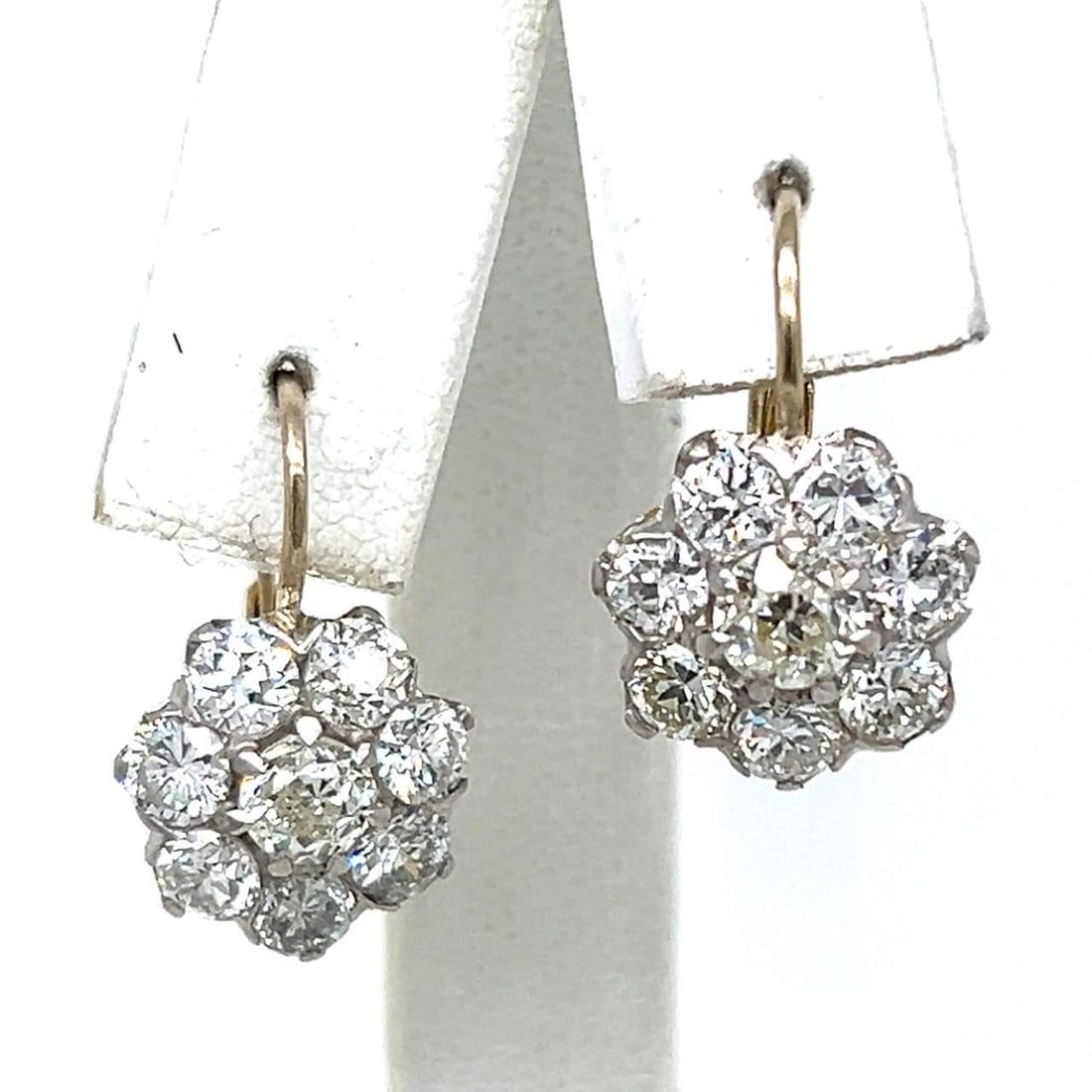 18K Yellow Gold Platinum 3.20 Ct Diamond Cluster Earrings: 18K Yellow Gold Platinum 3.20 Ct Diamond Cluster Earrings These exquisite 18K Yellow Gold and Platinum earrings feature a stunning cluster of diamonds totaling 3.20 carats. The design includes 2 Old M