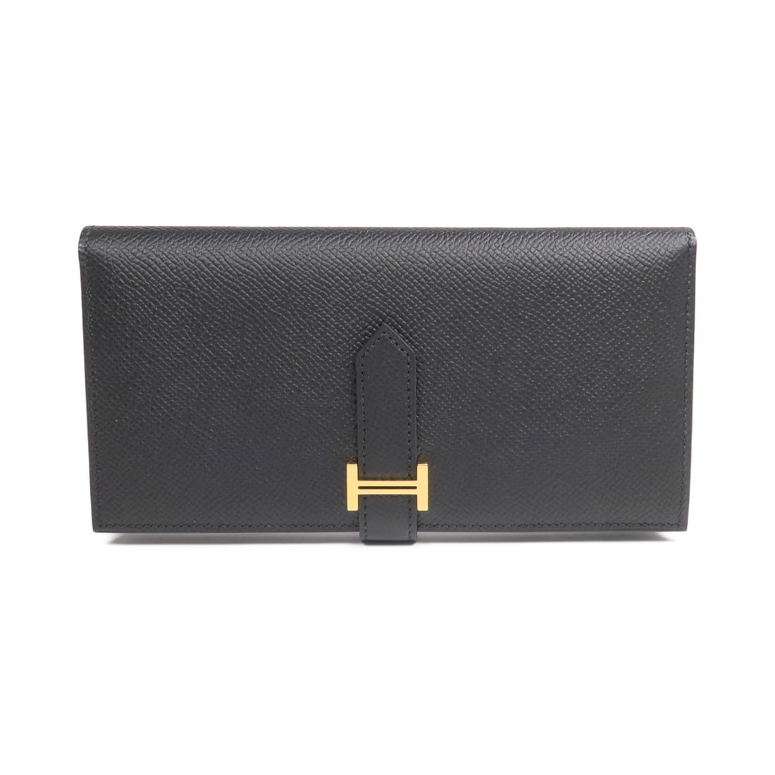 Black Epsom Leather Bearn Wallet by Hermes with Gold Hardware: Black Epsom Leather Bearn Wallet by Hermes with Gold Hardware This Hermes Bearn bifold wallet is crafted from Epsom calfskin leather in black. It features gold tone hardware, offering an elegant and t