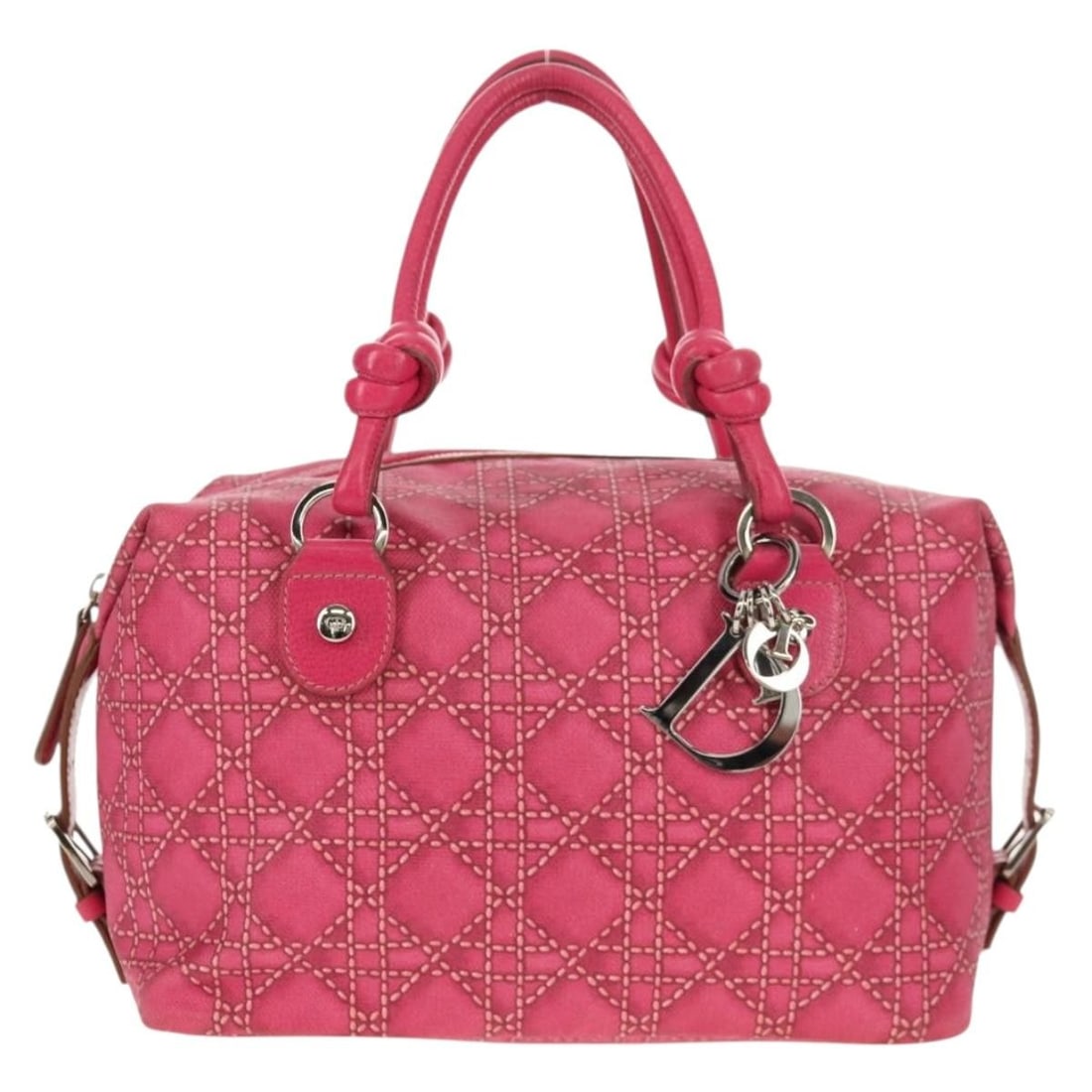 Pink Canvas Cannage Shoulder Bag by Christian Dior Italy: Pink Canvas Cannage Shoulder Bag by Christian Dior Italy This Christian Dior Cannage handbag is crafted from pink canvas and features the iconic quilted design. Designed for women, it offers a spaciou