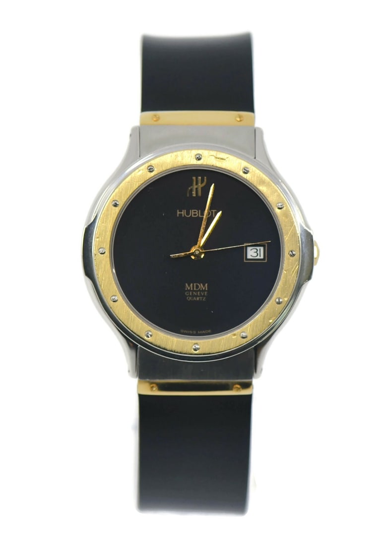 Hublot MDM Two Tone Stainless Steel Quartz Watch: Hublot MDM Two Tone Stainless Steel Quartz Watch Discover the exquisite Hublot MDM Two Tone Stainless Steel Watch, a perfect blend of elegance and functionality. This pre-owned wristwatch features a r