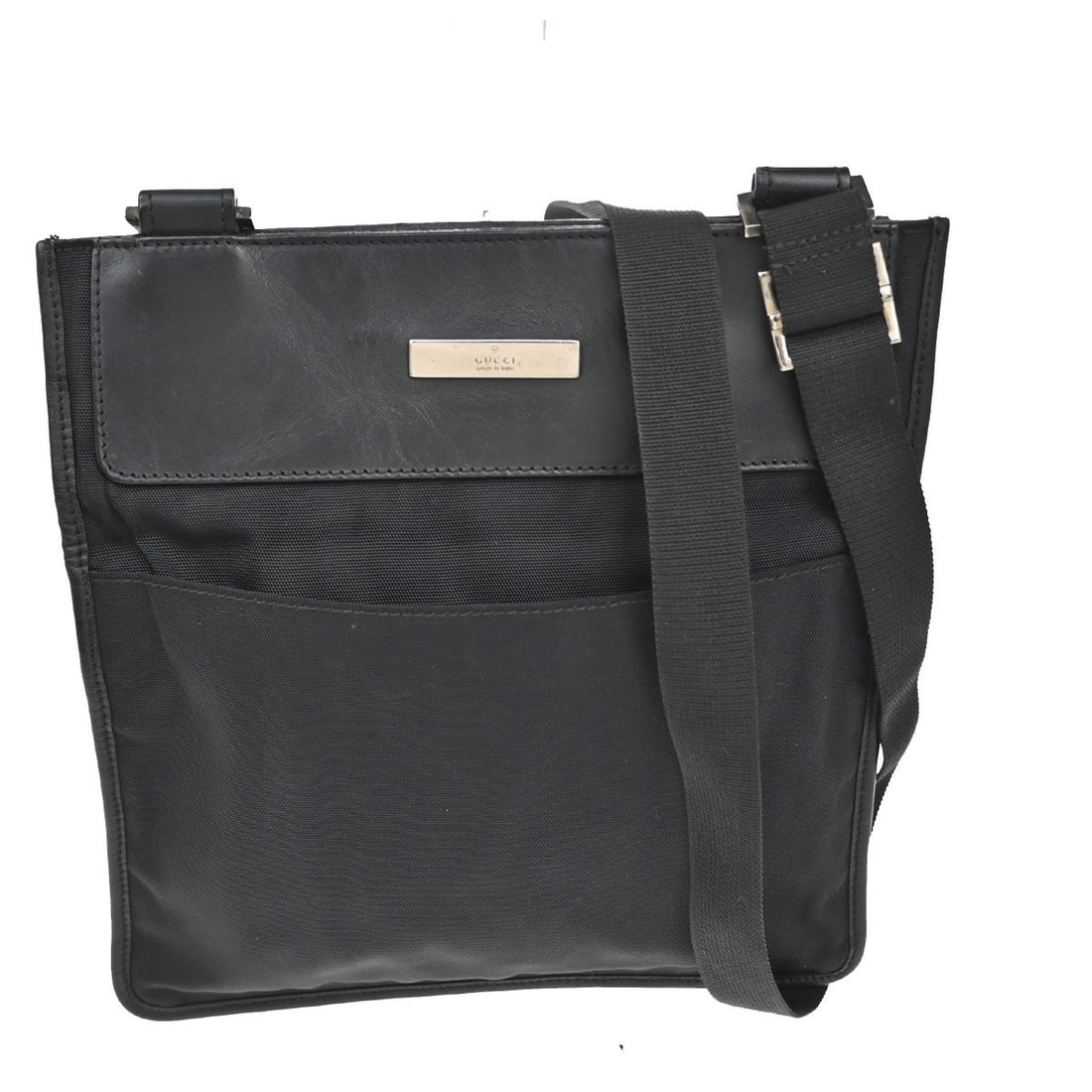 Vintage Gucci Black Nylon Shoulder Bag 24cm by 25cm: Vintage Gucci Black Nylon Shoulder Bag 24cm by 25cm This unisex vintage shoulder bag from Gucci features durable black nylon material and a sleek design, ideal for everyday use. It measures 24cm by 25