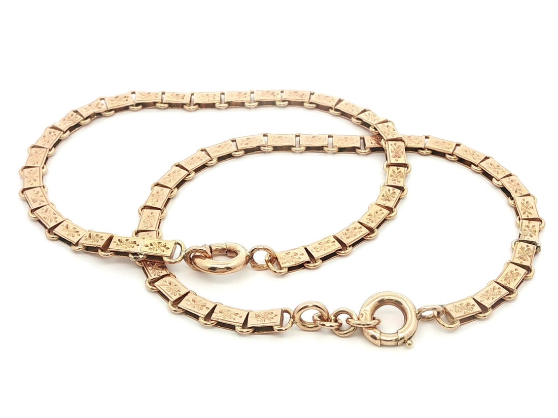 Antique French 18k Rosy Yellow Gold Hand Engraved Bracelets Pair: Antique French 18k Rosy Yellow Gold Hand Engraved Bracelets Pair Discover this exquisite pair of antique French bracelets, meticulously crafted from solid 18k rosy yellow gold. Each bracelet features