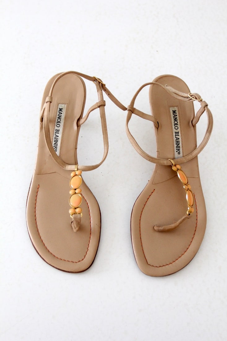 Vintage Manolo Blahnik Beige Suede Sandals with Coral-Peach Beading: Vintage Manolo Blahnik Beige Suede Sandals with Coral-Peach Beading Step into classic elegance with these vintage Manolo Blahnik sandals. Crafted from soft beige suede, these sandals feature stylish k