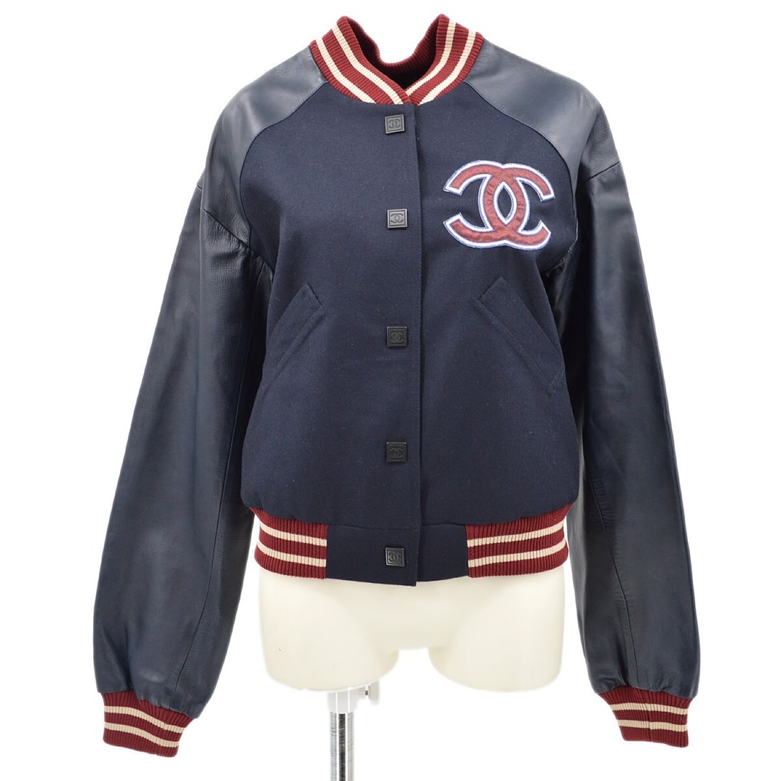 Chanel Navy Wool Letterman Bomber Jacket 04P Size 38: Chanel Navy Wool Letterman Bomber Jacket 04P Size 38 Elevate your wardrobe with this stylish Chanel Spring Letterman Bomber Jacket, crafted in France. This mid-length blazer features a luxurious 100%